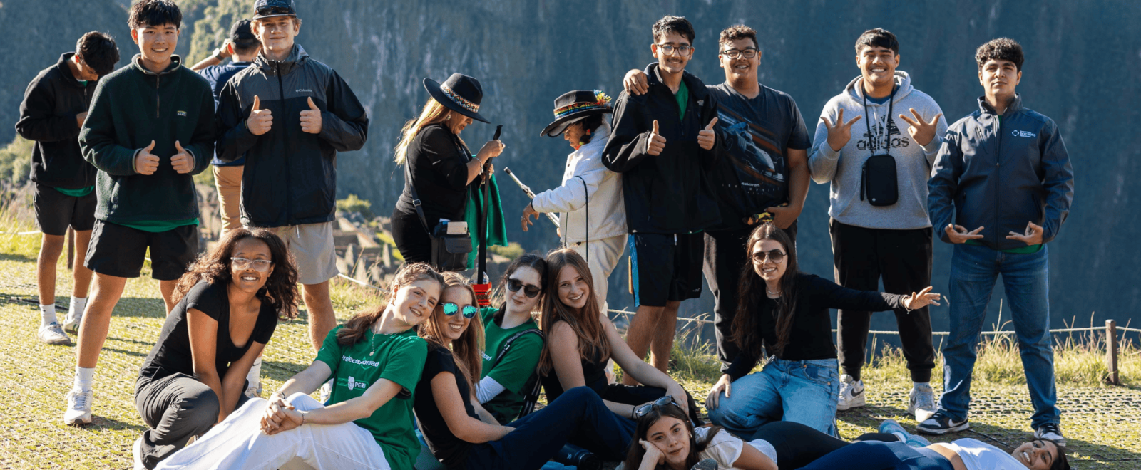 Expedition Peru  - group of teen travellers pose overlooking Machu Picchu